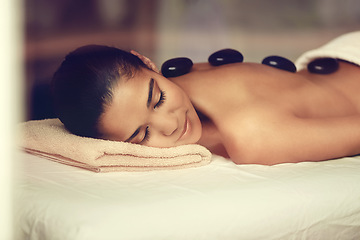 Image showing Girl, rocks or back massage in spa to relax for zen resting, sleeping or wellness physical therapy hotel resort. Calm woman in salon to exfoliate for body healing treatment or hot stone detox therapy