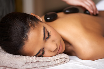 Image showing Woman, hands or back massage with rocks in spa to relax for zen, sleeping or wellness physical therapy. Girl, rest or calm client in salon to exfoliate for body healing treatment or hot stone therapy