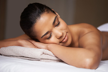 Image showing Girl, sleeping or massage in hotel to relax for zen resting or wellness physical therapy in calm luxury spa. Woman with eyes closed in salon for body healing treatment or natural holistic detox care