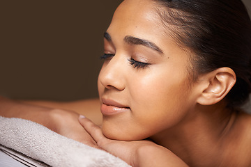 Image showing Woman, eyes closed or massage in hotel to relax for zen resting or wellness physical therapy in luxury spa. Face of girl sleeping in salon resort for body healing treatment or natural holistic detox