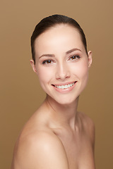 Image showing Portrait, mockup and woman with cosmetics, makeup and wellness against a brown studio background. Face, female person and model with happiness, luxury and salon treatment with beauty and aesthetics