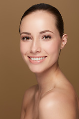 Image showing Portrait, beauty and woman with a smile, dermatology and skincare against brown studio background. Face, female person or model with wellness, bare and cosmetics with confidence, luxury and soft skin