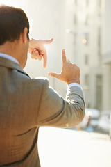 Image showing Hands, frame and focus with man in city for vision, building and thinking with mockup. Inspiration, planning and idea with male employee and finger gesture for freedom, motivation and insight