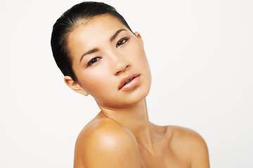 Image showing Natural beauty, woman and studio portrait with skincare and dermatology with confidence. Isolated, white background and Asian female person with face makeup and skin glow from cosmetics and treatment