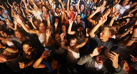 Image showing Music, dance and party with crowd at concert for rock, live band performance or festival. New year, energy and disco with audience of fans listening at celebration for techno, rave or nightclub event