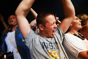 Image showing Music, dance and party with crowd at concert for rock, live band performance and festival show. New year, celebration and energy with audience of fans cheering for disco, techno and nightclub event