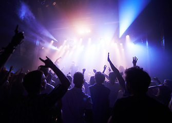 Image showing Music, dance and party with crowd at concert for rock, live band performance and festival show. New year, celebration and disco with audience of fans listening to techno, rave and nightclub event