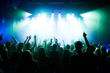 Image showing Music, dance and party with crowd at concert for rock, live band performance and festival show. New year, celebration and disco with audience of fans listening to techno, rave and nightclub event