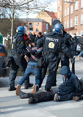 Image showing Police men, criminal and arrest in the city of Denmark for street safety, security or law enforcement. Group of legal government officers arresting people in a urban town for crime, justice or riot