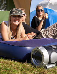 Image showing Women, relax and mattress at outdoor festival with happiness, camping or sunshine on grass. Friends, portrait and freedom with smile, support and summer vacation on camp, event or adventure in nature