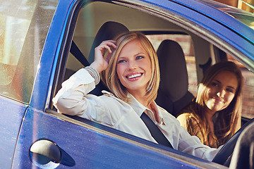 Image showing Car, travel and friends smile, happy and on urban city journey, transport or street road trip in motor vehicle. Automobile transportation, driver happiness and driving woman looking at window view