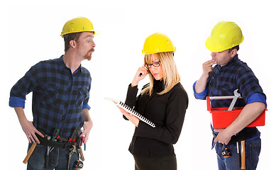 Image showing angry businesswoman and construction workers 