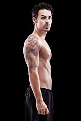 Image showing Portrait, man and bare bodybuilder on black background, dark studio and muscular abdomen tattoo. Sexy, serious and strong male model, sports athlete and fitness power for exercise, training or muscle