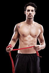 Image showing Sports man, challenge and boxer in portrait studio for professional competition for workout. BoxIng, training and hand for fight with exercise for the body with focus and motivation for fitness.