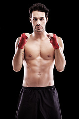 Image showing Portrait, boxer and man with fists in bandage or focus, thinking and ready for boxing fight in isolated studio black background. Athlete, martial arts and healthy fitness, strong fighter and sports