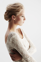 Image showing Thinking, profile and lace with an elegant woman in studio on a white background for beauty or makeup. Idea, cosmetics or side view with an attractive young female model posing in lacy underwear