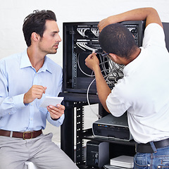 Image showing Server room, businessman or electrician fixing cables for maintenance after digital glitch in office. Network, hardware or worker with a technician or electrical engineer for information technology
