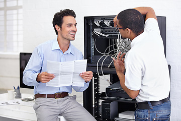 Image showing Server room, it support and manual with a technician talking to a business man about instructions to follow. Network, database and installation with an engineer chatting about information technology