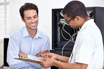 Image showing Server room, happy man or technician speaking of hardware maintenance or glitch in business office. Network, tech support or worker with electrician or electrical engineer for information technology