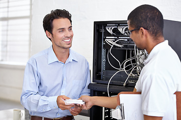 Image showing Server room, man or technician giving modem hardware for maintenance for connection in business office. Electronics, help or worker with an electrician or tech support for information technology