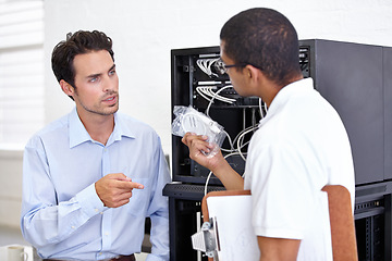 Image showing Server room, it support and wires with an engineer talking to a business man about hardware or cable replacement. Network, database and spare parts with a technician explaining information technology