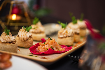 Image showing Kegs with salmon fish and cream sauce