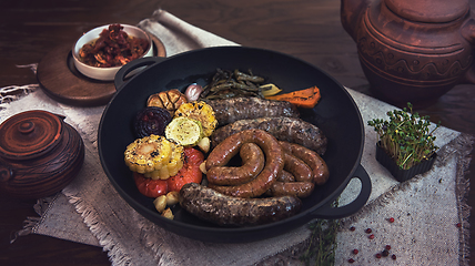 Image showing Grilled sausages with vegetables