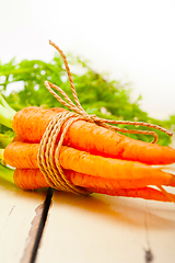 Image showing baby carrots bunch tied with rope