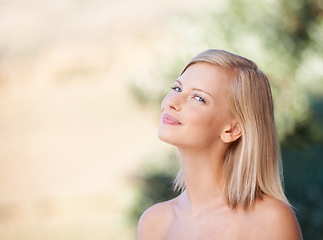 Image showing Woman, natural beauty and portrait of healthy skincare treatment on outdoor blurred background. Girl, happy and content after spa, facial care or minimal makeup, fresh skin glow and summer bokeh