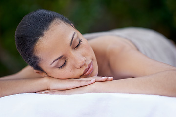 Image showing Sleep, massage and a woman on a spa bed for stress relief, luxury relaxation and wellbeing in nature. Relax, calm and a young lady sleeping after a skin treatment, pampering and wellness in a garden