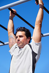 Image showing Man, fitness and pull ups on monkey bars in park gym for weightlifting, exercise or workout in nature. Fit, active and strong male lifting body weight or hanging on iron bar for strength exercising