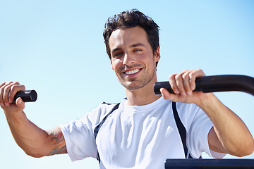 Image showing Happy man, fitness and portrait in shoulder press at park for gym workout, exercise or training in nature. Fit, active or strong male exercising on outdoor machine for muscle, chest or healthy cardio