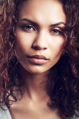 Image showing Beauty, closeup and portrait of woman in studio confident, beautiful and gorgeous on gray background. Salon, facial glow and face of female person with natural makeup, cosmetics and curly hairstyle