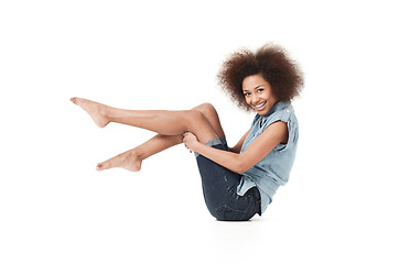 Image showing African woman, happy style and portrait holding legs on studio floor with casual fashion. Isolated, white background and young female person with body confidence and modern clothes on the ground