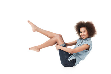 Image showing African woman style, sit and portrait on a studio floor with casual clothes and fashion. Isolated, white background and female person holding legs with body confidence and denim outfit on the ground