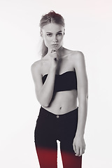 Image showing Portrait, fashion and gen z girl in studio with confidence while posing against white background. Fashionable, face and young female person with attitude or trendy, cool and modern crop top clothing