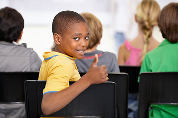 Image showing Portrait, black child and thumbs up of student in classroom, elementary school or class. Smile, education and kid with hand gesture for like emoji, agreement and learning, success and approval sign.