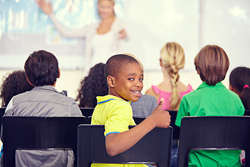 Image showing Portrait, black kid and thumbs up of student in class, elementary school or classroom. Smile, education and child with hand gesture for like emoji, agreement and learning, success and approval sign.