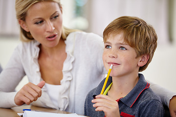 Image showing School, woman helping student with homework or question and in classroom. Education or learning, female teacher assisting male child and boy with pencil at mouth for thinking or find solution.