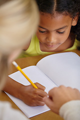 Image showing Closeup of teacher helping student, education and writing in notebook, teaching and learning for development. People in classroom to learn, academic study and young girl, woman in lesson at school