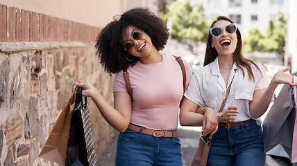 Image showing Friends, women with shopping bag and happiness in city, retail customer and fashion with shopper at outdoor mall. Excited female people in urban street, sale and discount with promotion at boutique