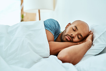 Image showing Relax, sleeping and man in bed, home and wellness with peace, comfortable or happiness. Male person, African or guy in a bedroom, healthy rest or dreaming with comfort, sleepy or tired with a blanket