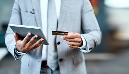 Image showing Man hands, tablet and credit card for online shopping, ecommerce and fintech application, loan or finance. Business person typing, website banking and digital tech payment or easy, office transaction