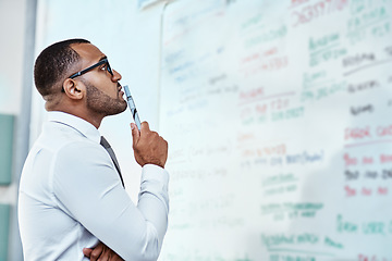 Image showing Thinking, planning and business man on whiteboard brainstorming, ideas and information or problem solving. Professional African person or corporate worker reading, solution and project notes on board