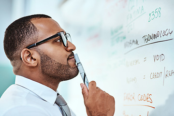 Image showing Thinking, finance and business man on whiteboard brainstorming, idea and numbers or budget problem solving. Accountant focus or African person reading data, accounting solution and financial profit