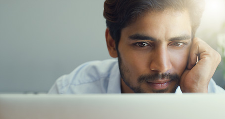 Image showing Mockup, business and man with a laptop, focus and thinking with ideas, inspiration and online reading. Male person, freelancer and employee with concentration, motivation and calm with technology