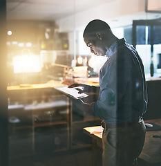 Image showing Professional black man, tablet and night business, information technology and software update. Male programmer work late, overtime and deadline with focus, concentration and cyber security upgrade