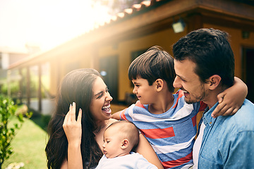 Image showing Happy family, smile or hug with children bonding or relaxing together on holiday weekend in backyard. Indian mother, father or kids outside home smiling or hugging a newborn baby with happiness