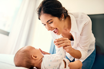 Image showing Happy, children and a mother with her baby in the bedroom of their home together for playful bonding. Family, love and a young mama spending time with her newborn infant on the bed for fun or joy