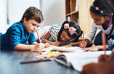 Image showing Drawing, writing and kids on the floor, coloring and diversity with fun, education and development. Children, students or kids on the ground, creative and paper in a room, art and school for learning